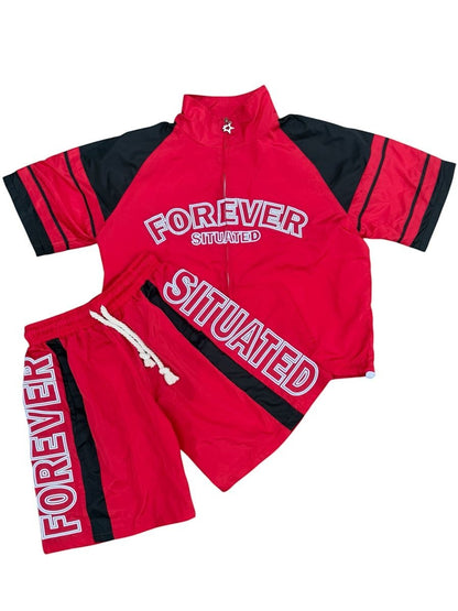 On Time Fashions red and black track short set with "FOREVER SITUATED" graphic on jacket and shorts.
