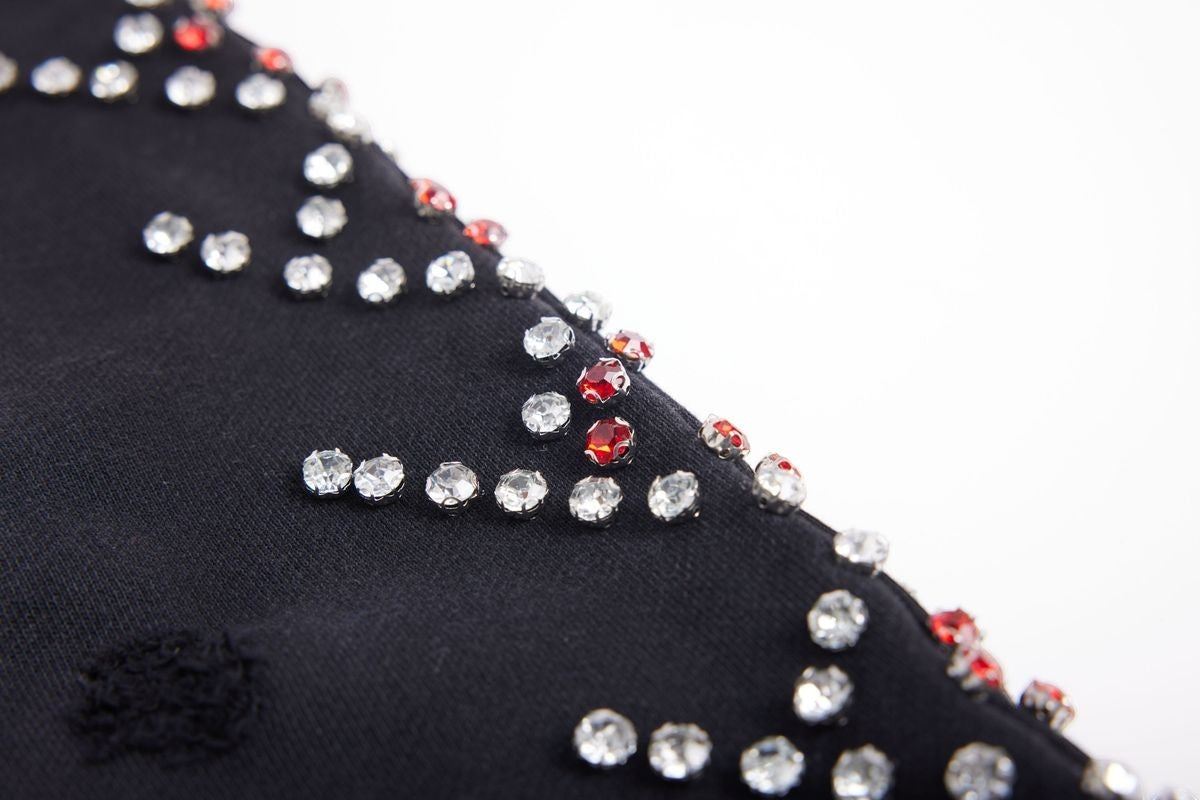 On Time Fashions black terry cloth shorts with rhinestone detailing and distressed patch.