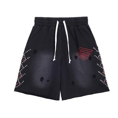 On Time Fashions black terry cloth shorts with rhinestone detailing on the sides and distressed accents.