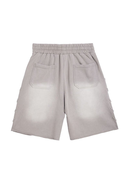 On Time Fashions grey terry cloth shorts with rhinestone detailing on the sides and elastic waistband.