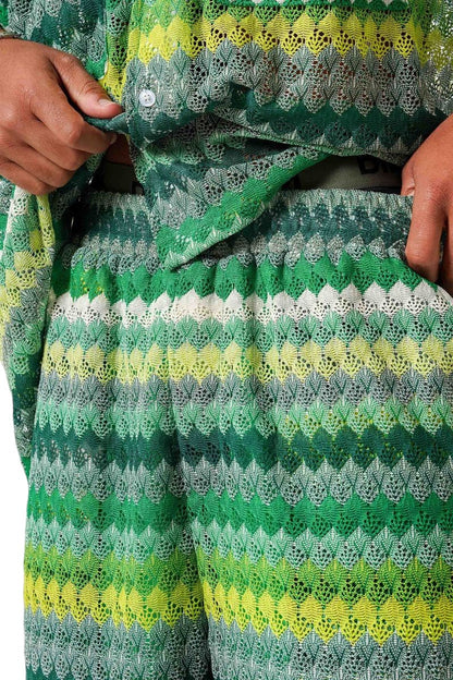On Time Fashions Striped crochet resort set with green, yellow, and white gradient pattern. Oversized shirt and matching shorts.