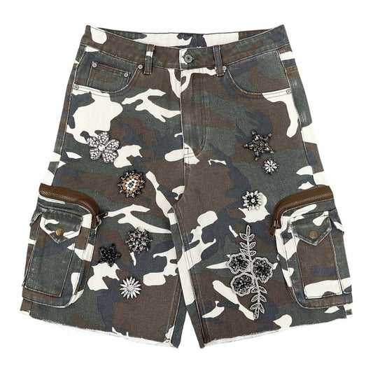 On Time Fashions Syndicate Eden camo denim jorts with floral and star crystal embellishments and side cargo pockets.