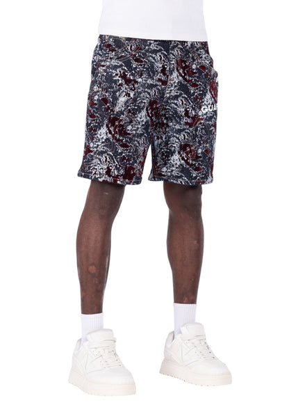 On Time Fashions Guapi wine red laser-etched velvet shorts with abstract marble pattern on a model