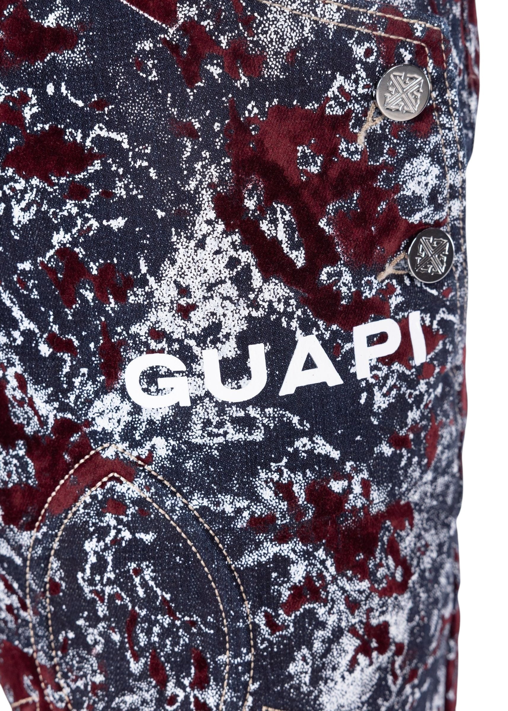 On Time Fashions Guapi wine red velvet shorts featuring a laser-etched abstract marble pattern and white logo detail.