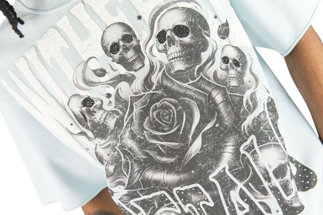 On Time Fashions light blue crop tee with skull and rose graphic, rhinestone accents, and raised textured lettering.
