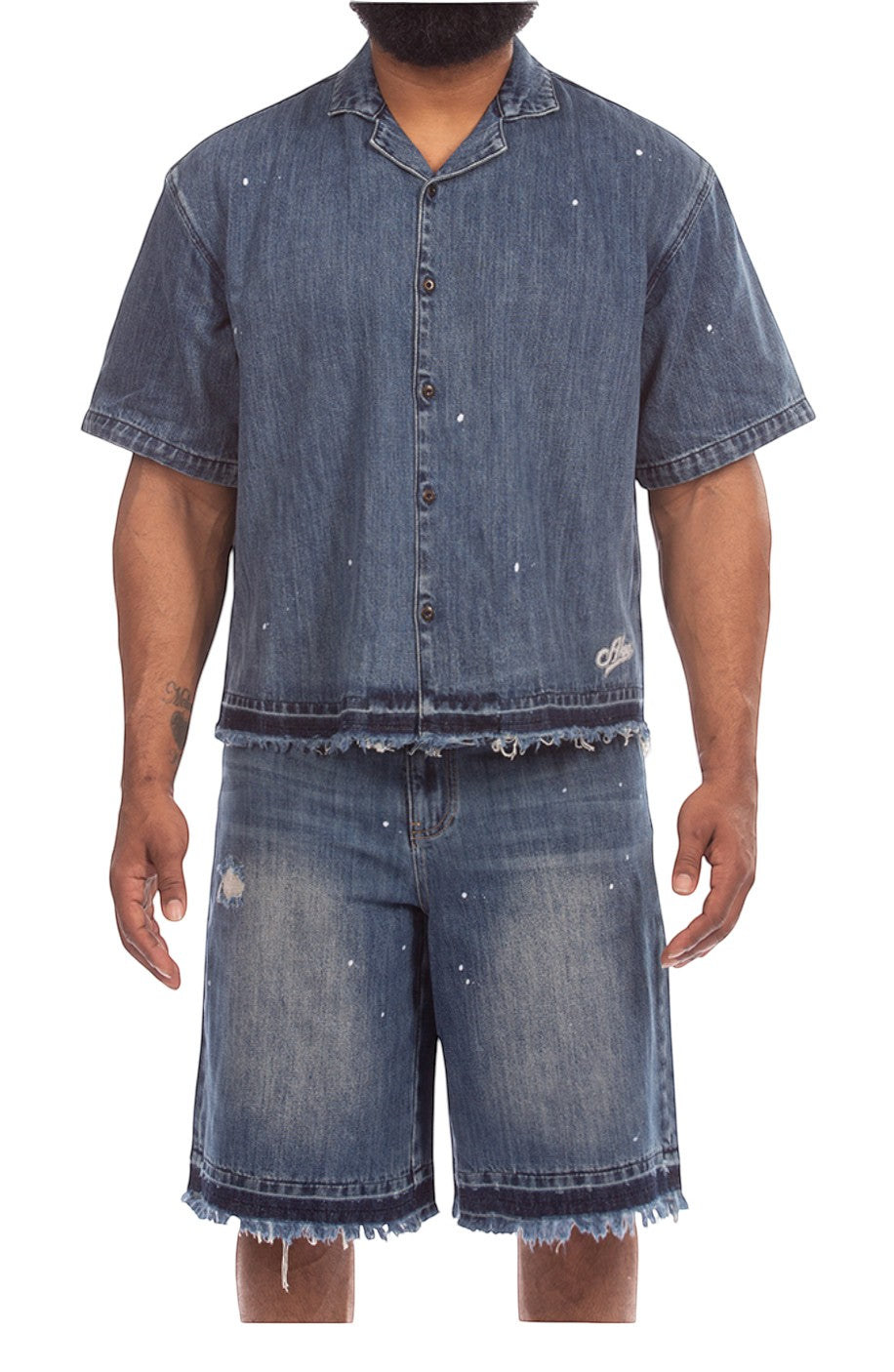 On Time Fashions men's blue denim shorts with paint splatter, distressed details, and frayed hem.