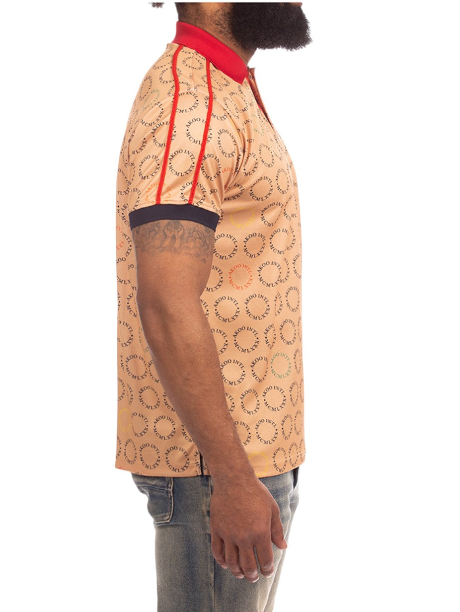 On Time Fashions Akoo Captain Polo shirt in tan with all-over print, red collar, and sleeve dark trim