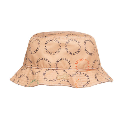 On Time Fashions Akoo Catamaran bucket hat in tan with allover print and rubber applique. Cotton.