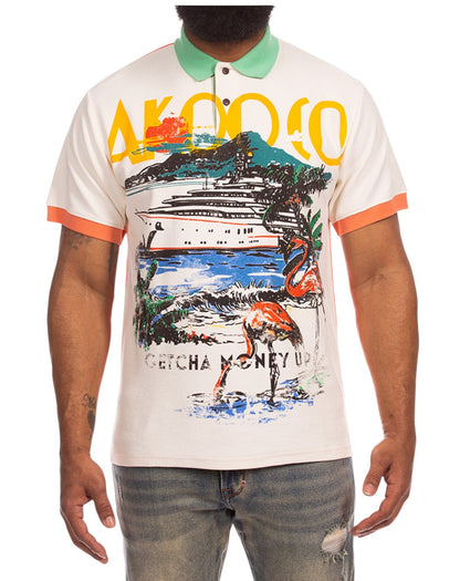 On Time Fashions Akoo We Out Polo: cream short sleeve polo with green collar, orange trim, and a vibrant graphic print of a yacht, flamingos, and tropical scenery.