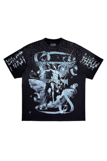 On Time Fashions black cotton tee with a celestial graphic featuring an angel, clouds, stars, and distressed text. Embellished with rhinestones on the shoulders and neckline.