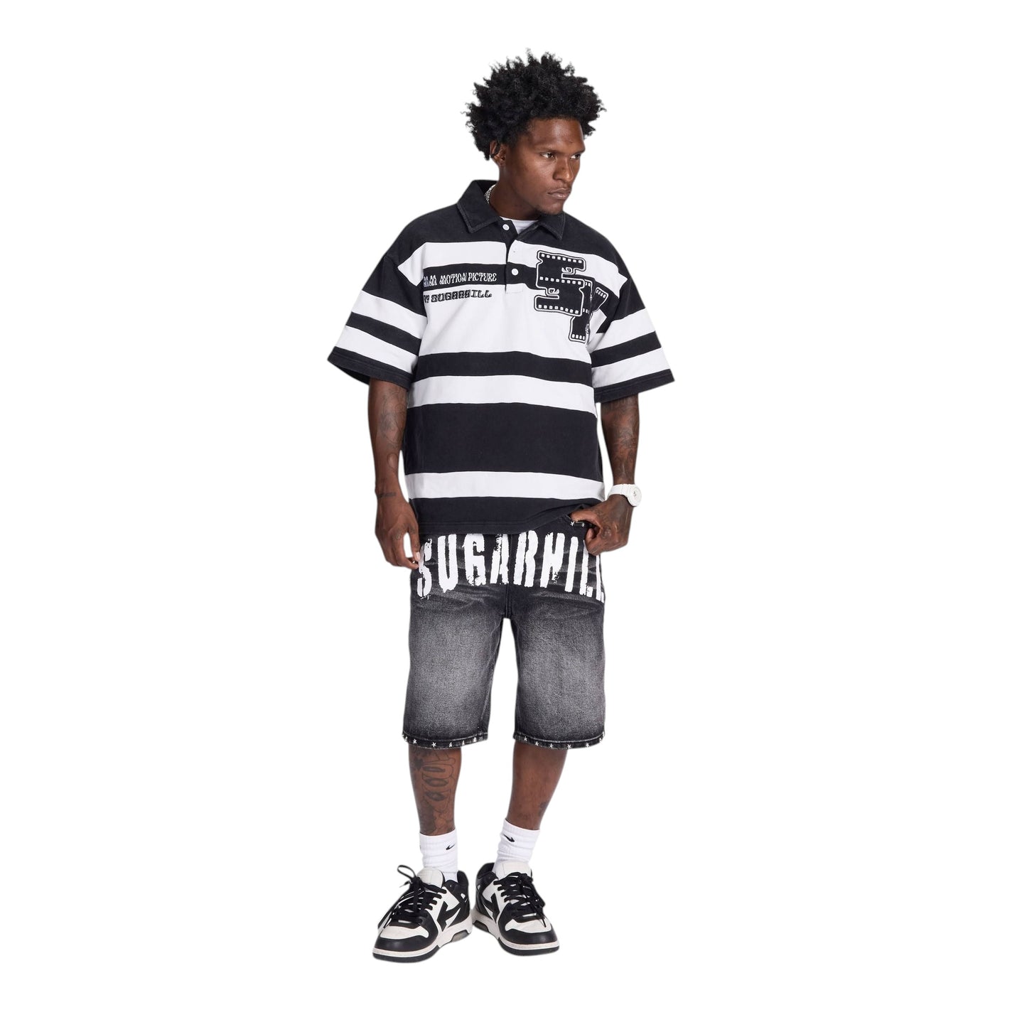 On Time Fashions men's black and grey distressed denim jorts with white "SUGARHILL" graphic waistband and studded hem.