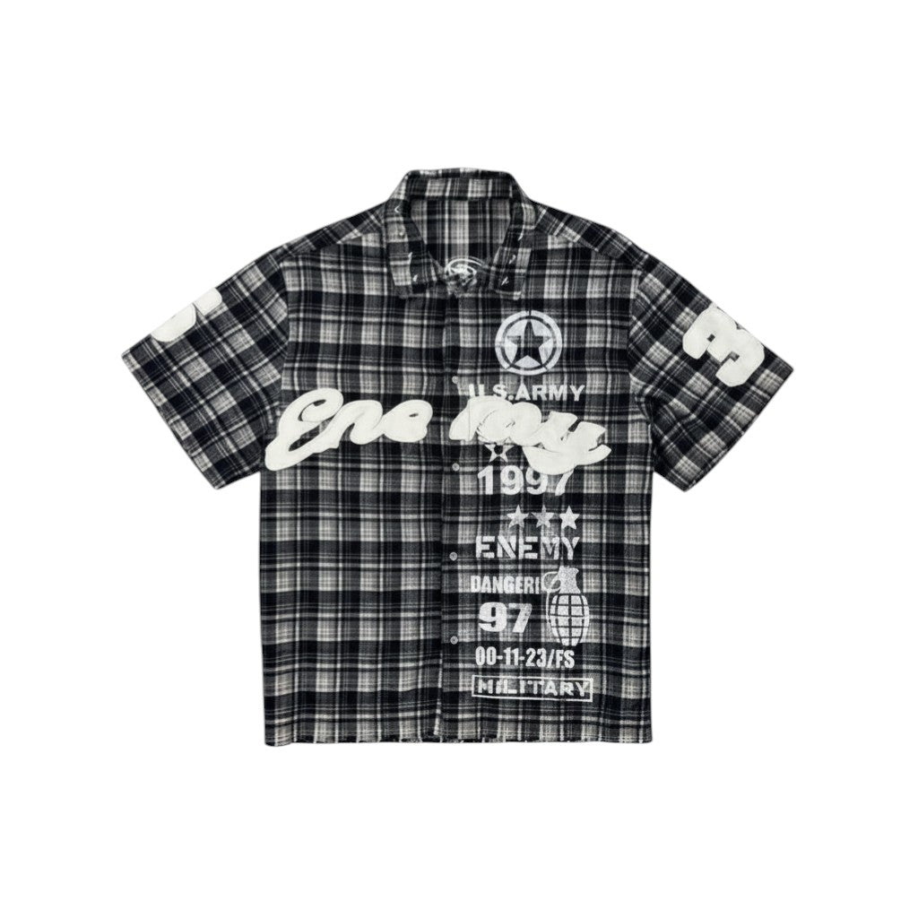 On Time Fashions black and white plaid short-sleeve shirt with graphic text and military-inspired designs.