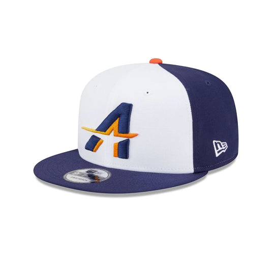 On Time Fashions Houston Astros City Connect 9FIFTY Snapback hat with white front panels, navy blue sides, and embroidered orange and navy 'A' logo.