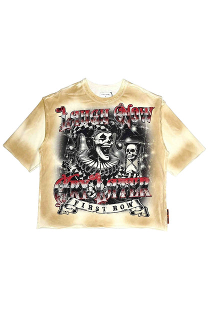 On Time Fashions cropped t-shirt with a distressed tie-dye effect in cream, featuring a jester and skulls graphic with 'Laugh Now Cry Later' text.