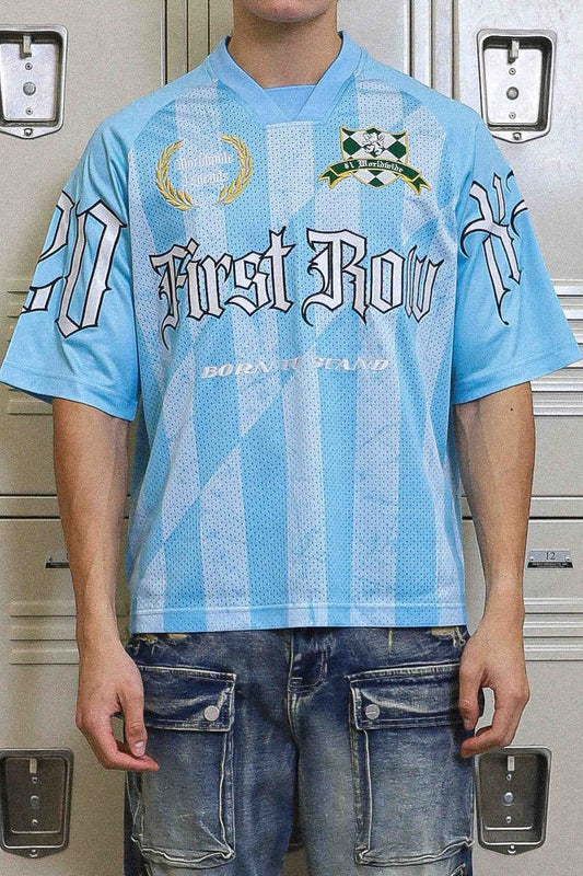 On Time Fashions light blue short sleeve sports jersey with white and black First Row graphic print and striped pattern.