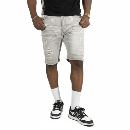 On Time Fashions Makobi Prego light wash distressed denim shorts with moto-style paneling.