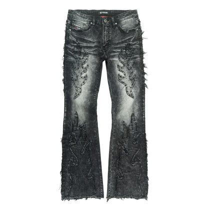 On Time Fashions Makobi Tesoro stacked jeans in distressed black denim with flame-like embellishments and frayed hems.