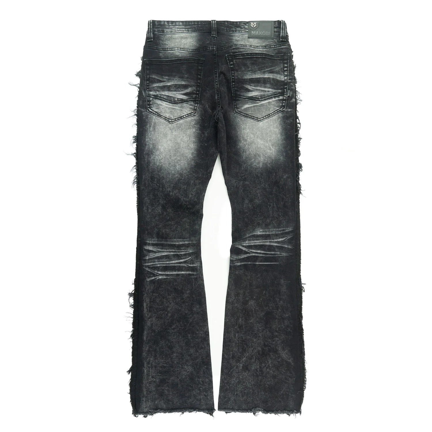 On Time Fashions Makobi Tesoro stacked jeans in black denim with distressed details and frayed hems.