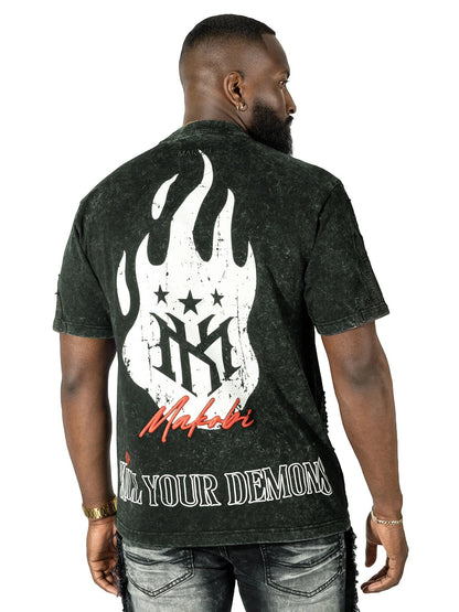 On Time Fashions Makobi Tesoro Tee, a dark wash, distressed cotton t-shirt with a graphic print of white flames, stars, and the Makobi logo on the back. Text reads "KILL YOUR DEMONS".