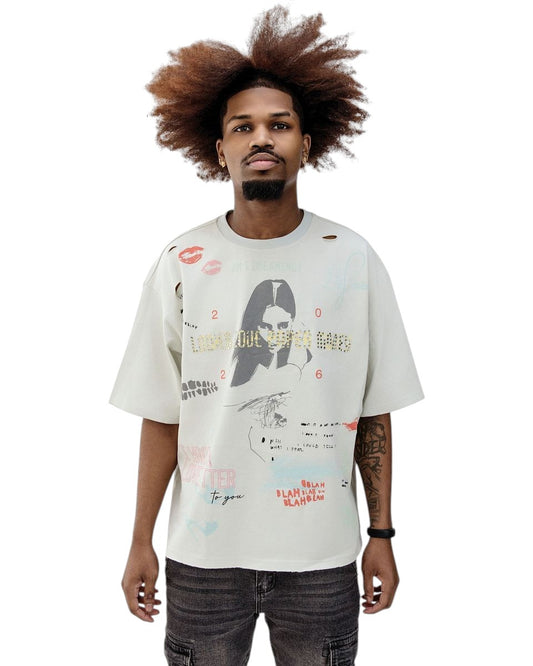 On Time Fashions Paper Money Love Letter Tee in cream with distressed details and graphic print. Model is wearing size M.