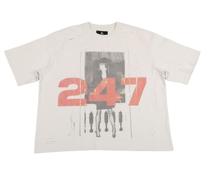 On Time Fashions Paper Money Rebel Tee, a light grey cotton t-shirt with a graphic print of a woman and the numbers "247" in red with silver studs.