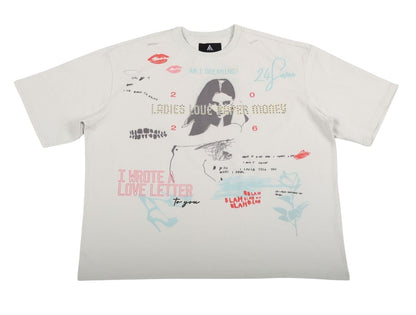 On Time Fashions white cotton graphic tee with distressed details, featuring a collage of drawings including lips, a woman's portrait, and text like "I WROTE A LOVE LETTER to you."