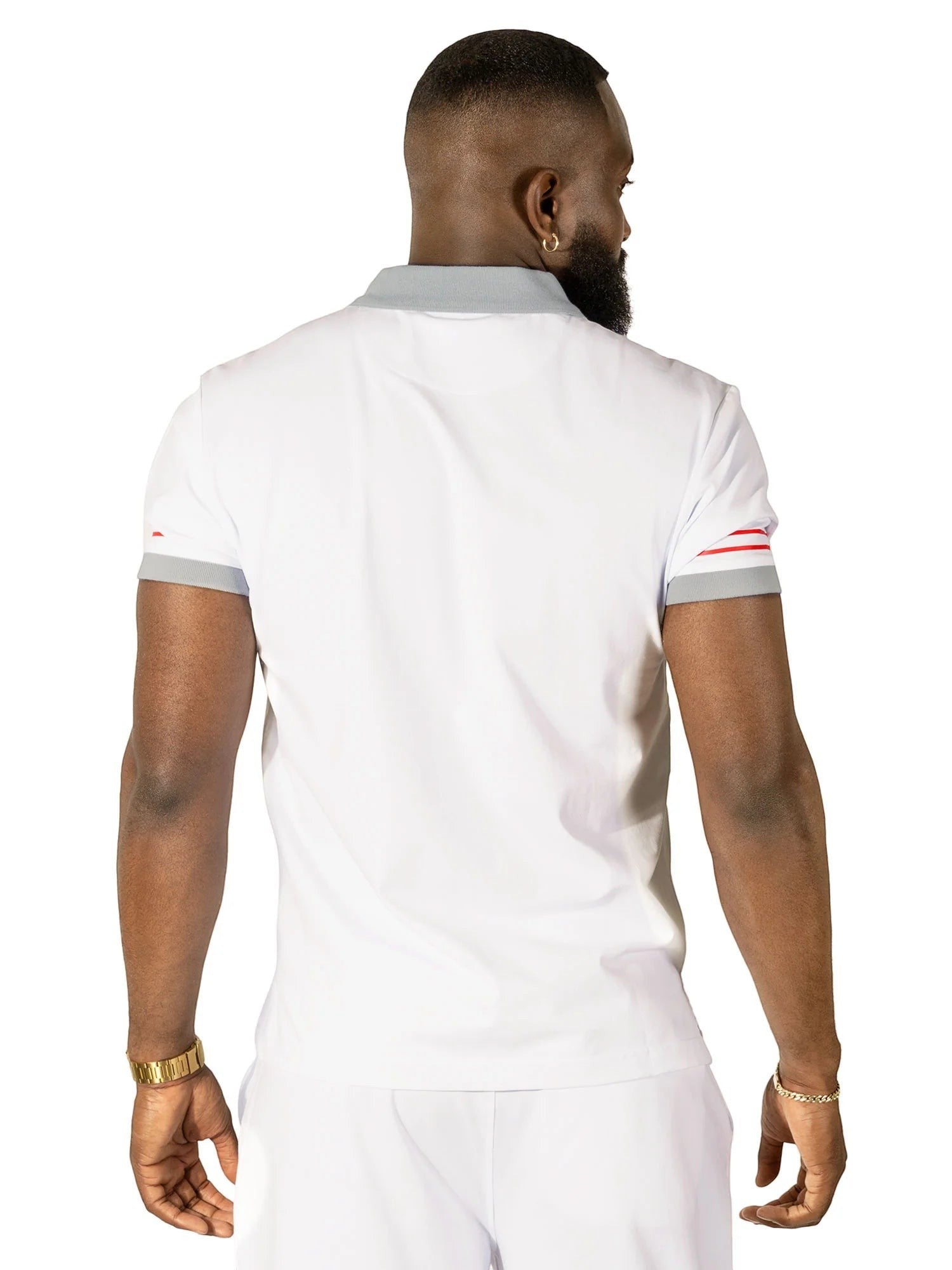 On Time Fashions white polo shirt with grey collar and red striped cuffs, worn by a man.