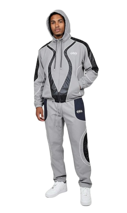 Model wearing the Rare Peace Studded Nylon Track Set in Light Grey