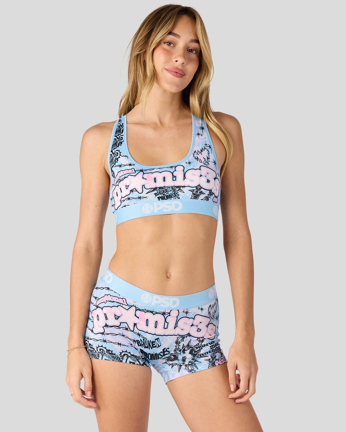 PSD Broken Promises Forever matching sports bra and boxer shorts set, shown on a model