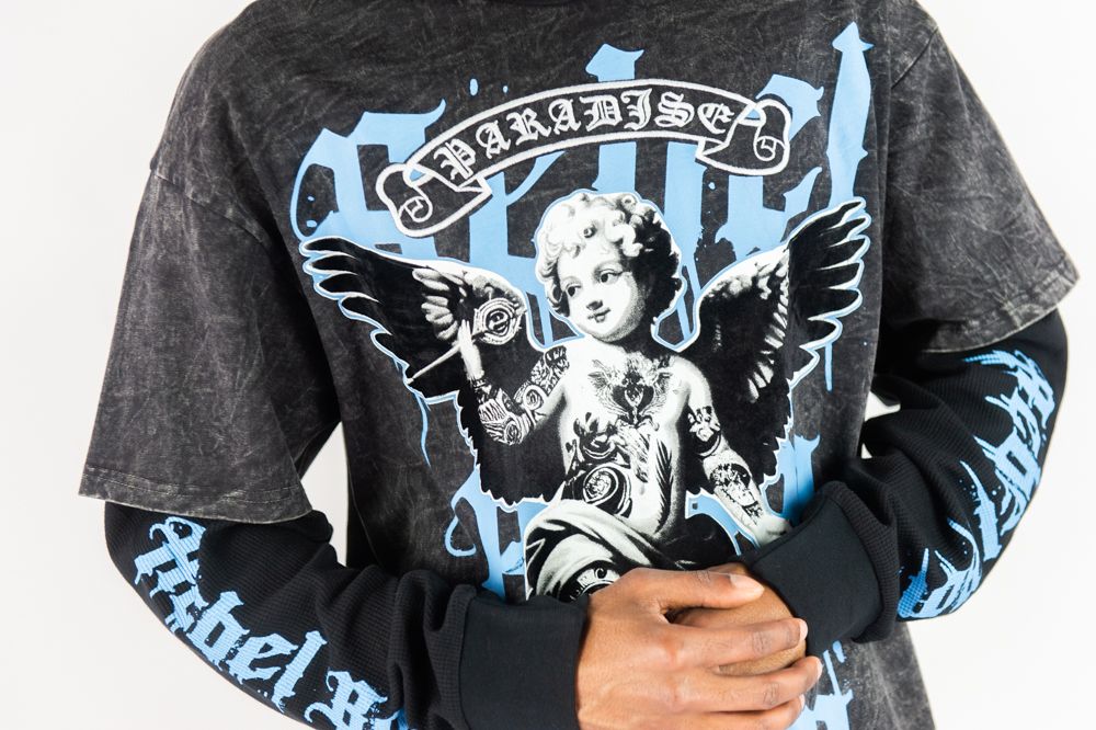 Rebel Minds Paradise Angel Layered Tee from On Time Fashions – tee by Rebel Minds, Birmingham AL’s 1 fashion store and premier destination for streetwear, suits, kids fashion, and big & tall