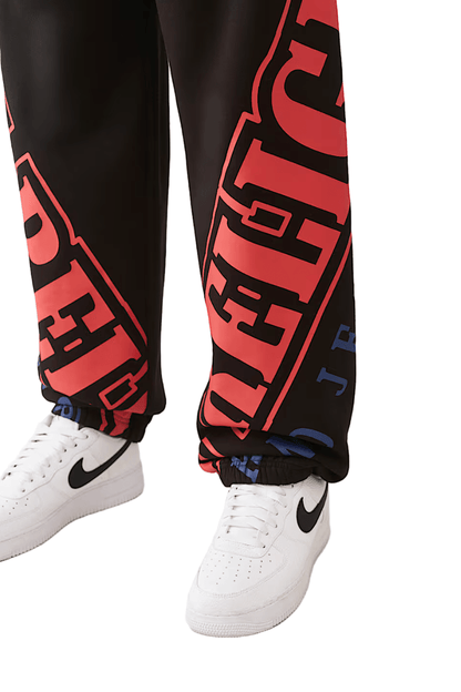 True Religion Arched Logo Baggy Jogger from On Time Fashions – Track Pants by True Religion, Birmingham AL’s 1 fashion store and premier destination for streetwear, suits, kids fashion, and big & tall