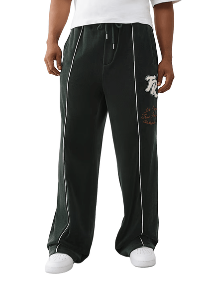 True Religion Logo Patch Velour Track Pants from On Time Fashions – Track Pants by True Religion, Birmingham AL’s 1 fashion store and premier destination for streetwear, suits, kids fashion, and big & tall