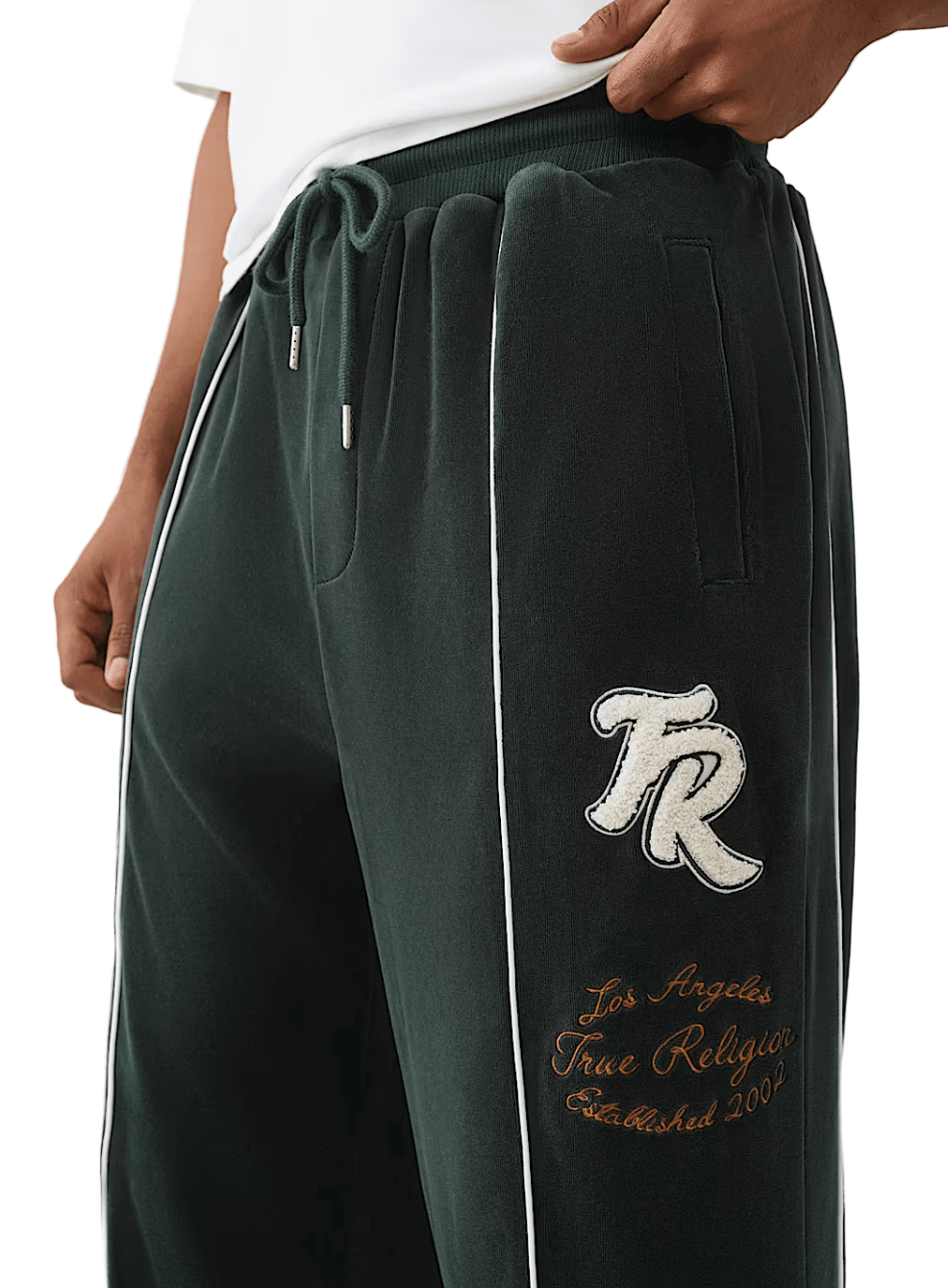 True Religion Logo Patch Velour Track Pants from On Time Fashions – Track Pants by True Religion, Birmingham AL’s 1 fashion store and premier destination for streetwear, suits, kids fashion, and big & tall