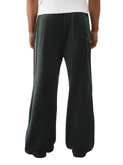 True Religion Logo Patch Velour Track Pants from On Time Fashions – Track Pants by True Religion, Birmingham AL’s 1 fashion store and premier destination for streetwear, suits, kids fashion, and big & tall