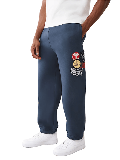 True Religion Vintage Patch Baggy Jogger from On Time Fashions – Sweatpants/Joggers by True Religion, Birmingham AL’s 1 fashion store and premier destination for streetwear, suits, kids fashion, and big & tall