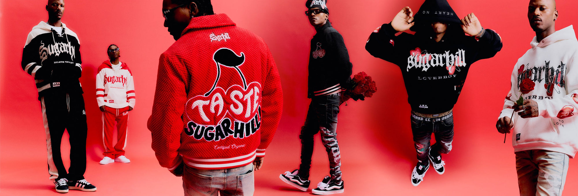 Back view of a model wearing a red Sugarhill knit jacket with a large cherry graphic in the original red-studio campaign.